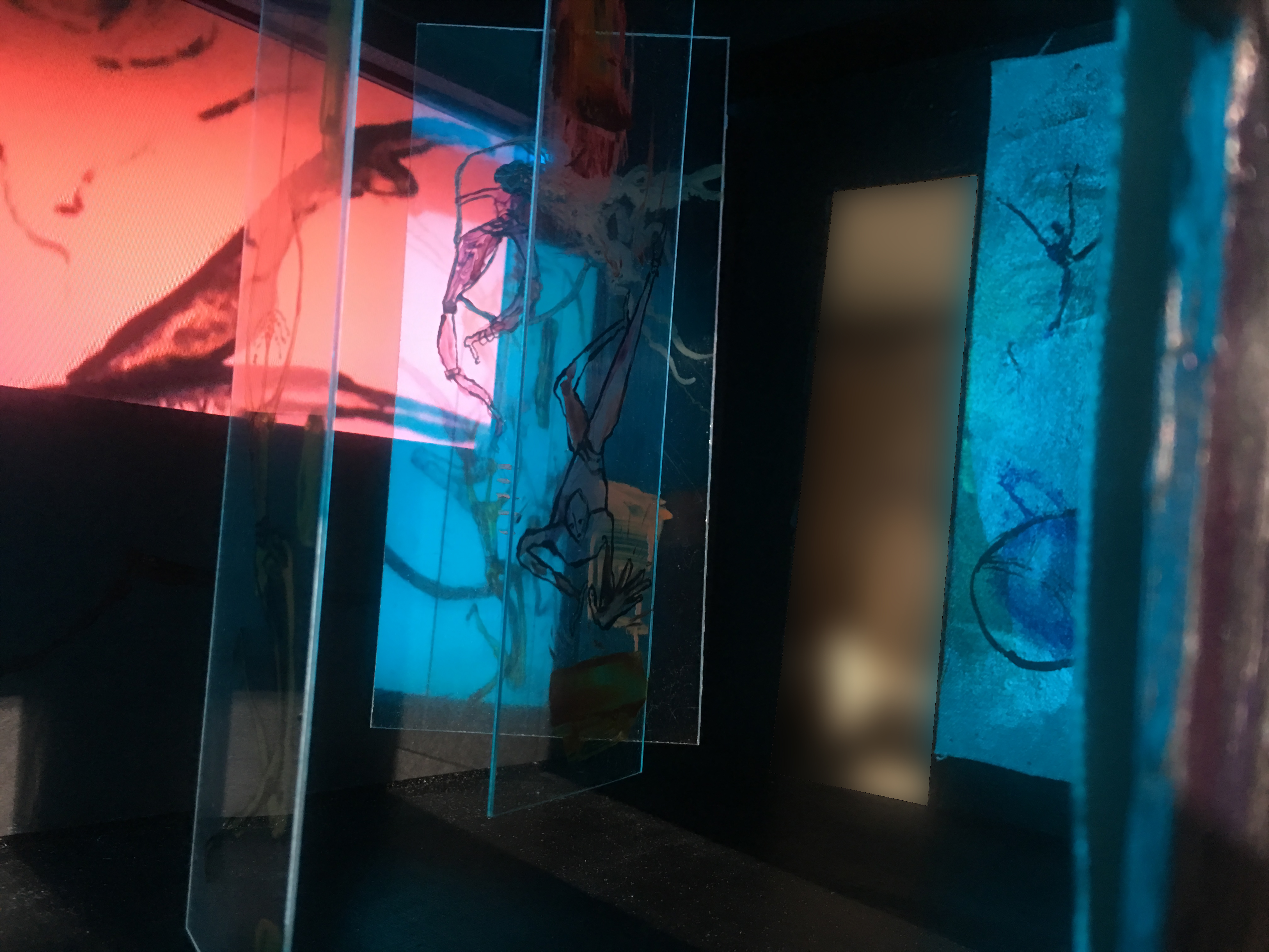 looking inside from front opening – in front of clear painted acrylic panels with video to the left and silver painting on the right